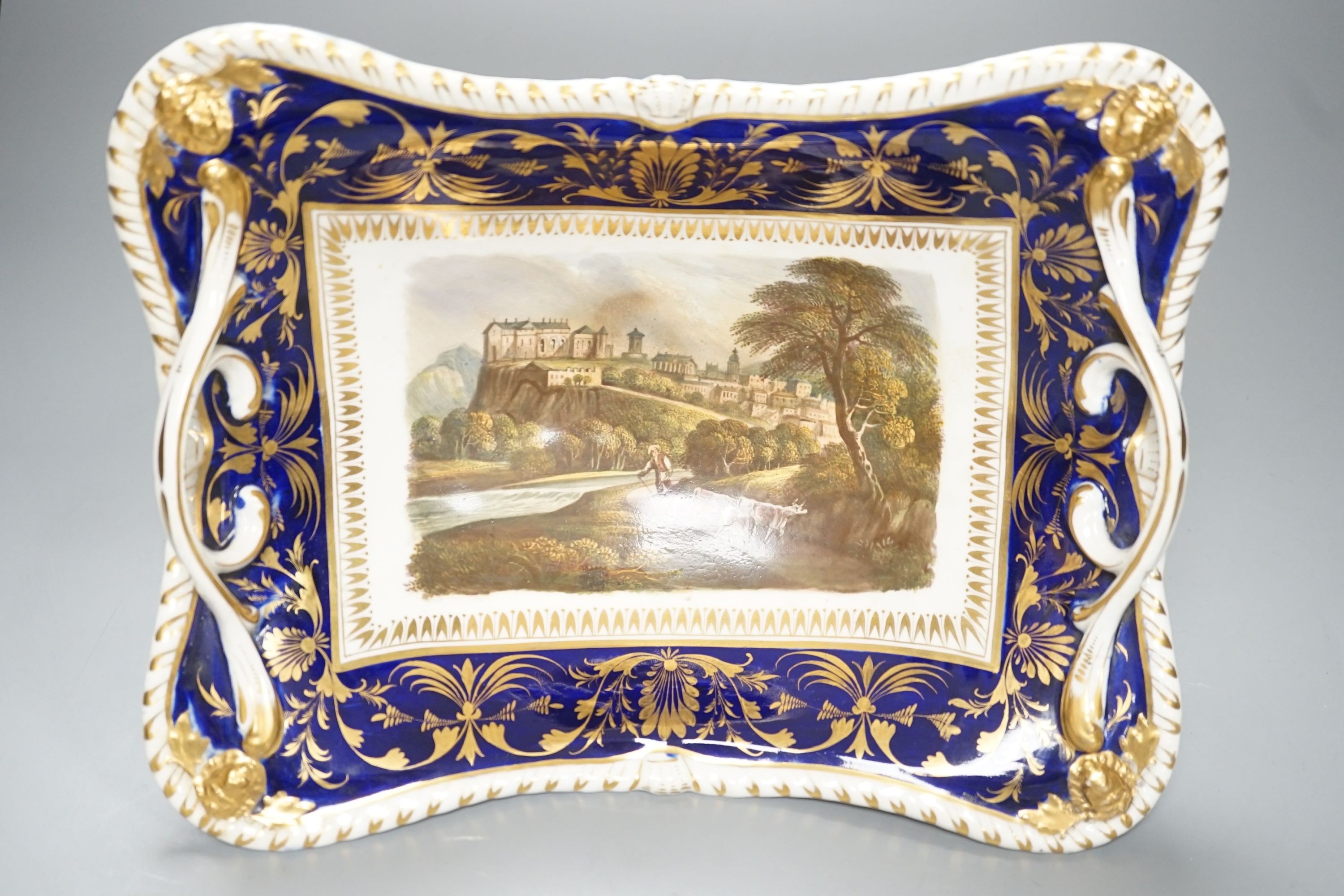 A Derby two handled pedestal dish with a named view of Sterling Castle, under a blue and gilt border probably by Daniel Lucas, c.1815, width 29cm